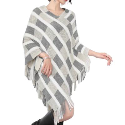 China Anti-Wrinkle Women's Stylish Knitted Poncho Sweater With Stripe Patterns And Fringed Sides Shawl Lightweight Pullover for sale