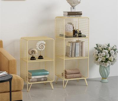 China Luxury Nordic Light Shelf Bedroom Small Shelf Gold Cabinet Bedside Iron Metal Grid Storage Floor Standing Shelf for sale