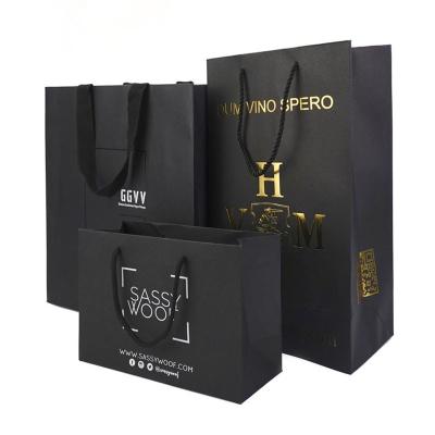 China Handmade Customized Gold Foil Stamping Logo Rivet Paper Bags Custom Shopping Paper Bag With Logo For Packaging for sale