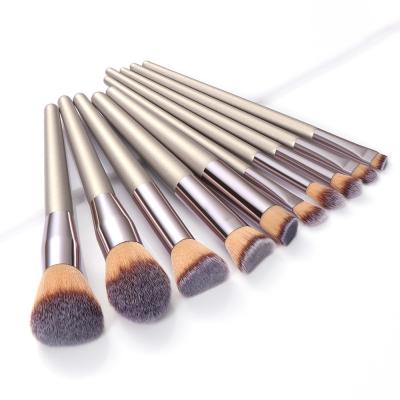 China Angular Blush XINYAN Custom Label 10 Piece Nylon Hair Makeup Brush Gold Silver Makeup Blush Brushes for sale