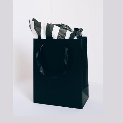 China Custom Print Recycled Materials Logo Boutique Black Paper Bag With Handle for sale