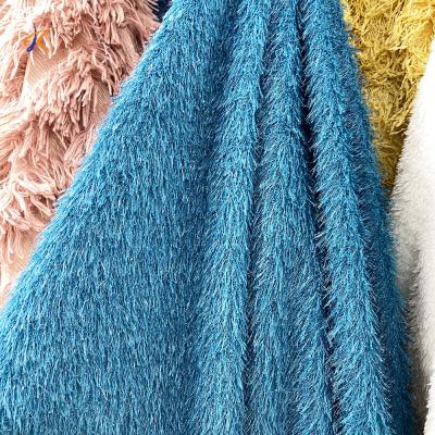 China Anti-skid Blue Faux Long Fur Quality Gold Pile Jacquard Plush Imitation Shiny Faux Fur Fabric for sale