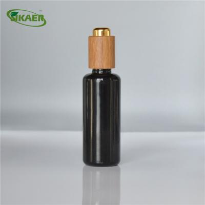 China Personal care frosted new round 1oz purple amber clear cosmetic glass dropper bottle with bamboo cover for sale