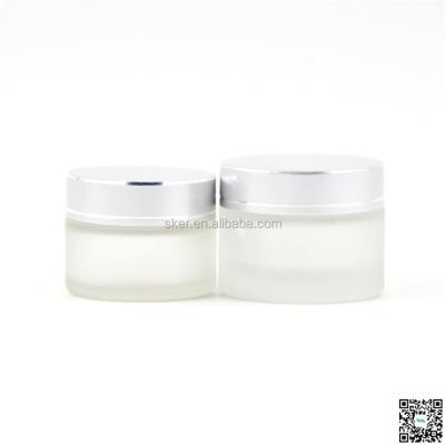 China Personal Care Cosmetic Transparent Glass Cream Jar With Ribbon Cap for sale