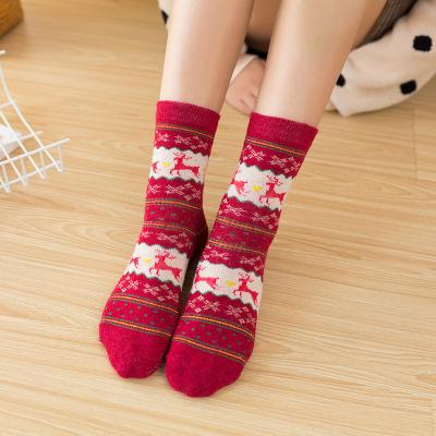 China Autumn Christmas QUICK DRY Winter Socks Wool Women Thicken New Warm Home Socks Alpaca Wool Santa Claus Graphic Socks for sale