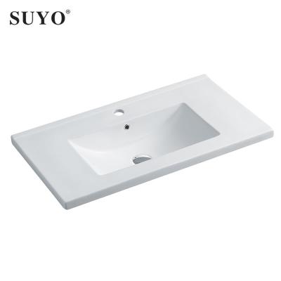 China Luxury SUYO Factory Porcelain Cabinet Vanity Hand Wash Sink Bowl Modern Middle Edge Toilet Bowl Basin for sale