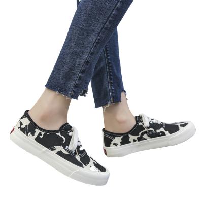 China Cushioning Wholesale latest comfortable ladies round toe cow print flat rubber sole plimsolls leopard women canvas shoes for sale