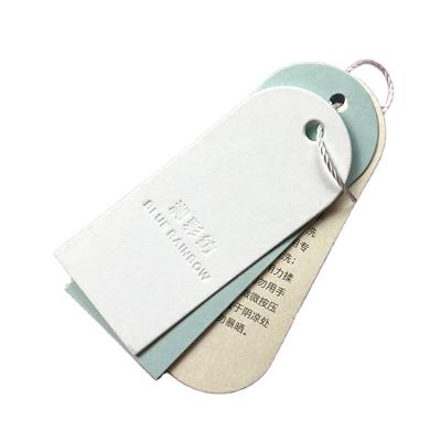 China Custom Luxury Clothing Hang Tags For Clothes Garment Recyled Fashion Paper Printed Brand Logo Hanging Tags for sale