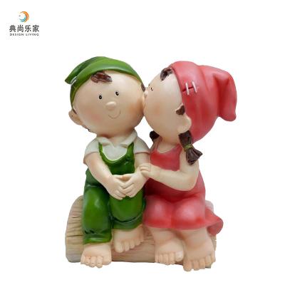 China Cute China Gift Item Small Boy And Girl Resin Figurines for sale