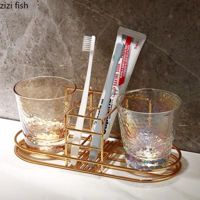 China Workable Metal Cup Holder Desktop Wash/Bathroom Cup Set Wall Supplies Mouthwash Cup Toothbrush Toothpaste Wall Hanging Storage Glass Rack for sale