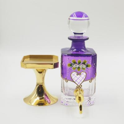 China Hot Selling 450ml Dubai Perfume Glass Oil Decanter Retail Bottle Display Glass Bottle Cosmetic With Copper Faucet for sale