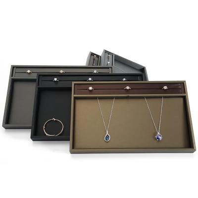 China Custom Leather Jewelry Tray For Rings,Earring,Necklace,Bracelet Counter Jewelry Display Stand Luxury Rectangular Jewelery Showcase for sale