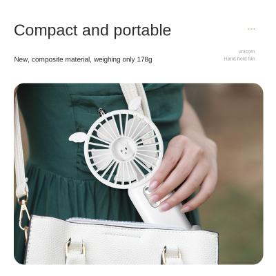 China New Outdoor Handheld Fan Desktop Usb Rechargeable Mini Fan With Night Light Cartoon And Mobile Phone Frame Silent Portable Fan for sale