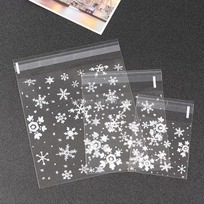 China Disposable Cheap Plastic Self Adhesive Seal Bags Clear Christmas Snowflake Cookie Gift Bags for sale