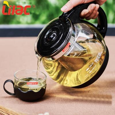 China Stock 1700ml Sufficient Hot Sufficient Hot Sale Lilac Thick Handle Whistling Flowering Flower Round Glass Teapot for sale