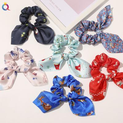 China New Christmas Decoration Qiyue Fashion Christmas Cartoon Pattern Printed Silk Satin Bunny Ear Scrunchies for sale