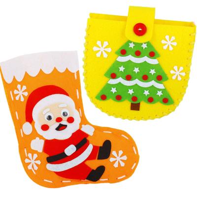 China It is suitable for kindergarten beauty work class Christmas decoration DIY handmade children's Christmas socks cartoon non-woven material package gift socks for sale