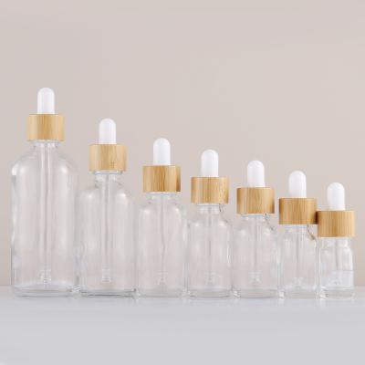 China 5ml-100ml Clear Frosted Bamboo Wooden Dropper Packaging Stain Essential Oil Cosmetic Empty Bottle Materials Glass Bottle for sale