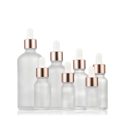 China 5ml-100ml Spot Packaging Material Cosmetic Empty Essential Oil Bottle Rose Gold Dropper Frosted Glass Bottle for sale