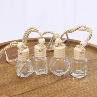 China Eco-friendly Wooden Metal Clip Screw Cap Car Air Freshener Vent Empty Transparent Frosted Glass Glass Perfume Bottle With Stick for sale