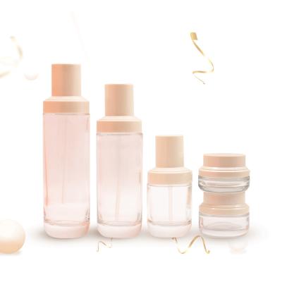 China Custom Wholesale 40ml 100ml 120ml Empty Cosmetic Clear Color Round Cream Toner Lotion Bottle And Glass Jar Set for sale