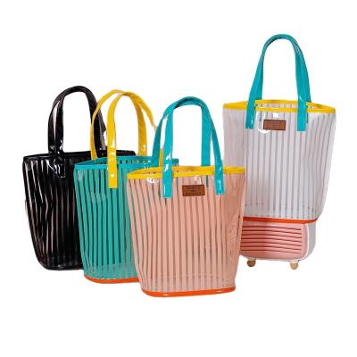 China 2022 New Fashion PVC Striped Print Portable Cosmetic Bag Women Fashion Large Capacity Wash Beach Bag for sale