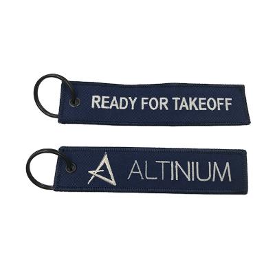 China Viable High Quality Custom Made Chain Keytags Fabric Logo Single Double Side Embroidery Flight Embroidered Key Rings for sale