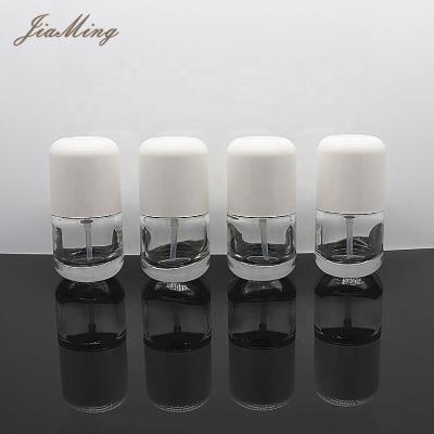 China Personal Care Cosmetic Packaging Cream Serum Round Shape Liquid Base 30ml Bottle Glass With Pump For Lotion Bottle for sale