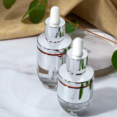 China 30ml Cosmetic Transparent Round Glass Clear Serum Bottle Dropper Skin Care Bottle for sale