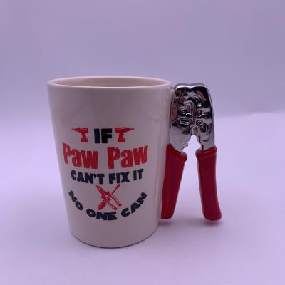 China Viable Custom Creative Ceramic Festival Novelty Gift Wire Mug Stripping Tongs Shaped Handle for sale