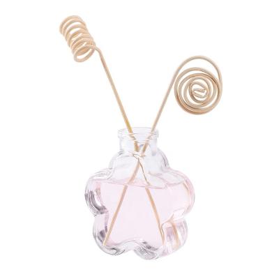 China Personal Care Flower Shaped Beauty Glass Perfume Diffuser Bottle With Rattan Sticks for sale