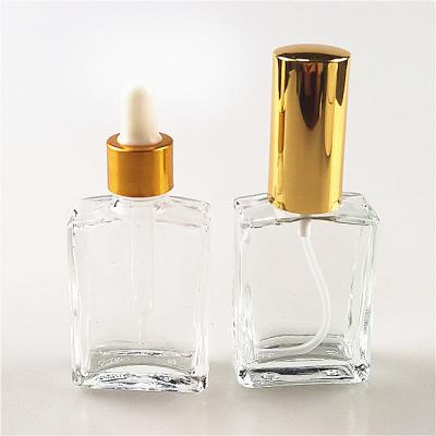 China Personal care 30ml refillable square clear empty glass perfume bottle with spray and dropper for sale