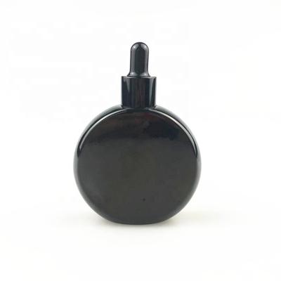 China Wholesale Personal Care Black 50ml Round Oil Perfume Bottle With Dropper for sale