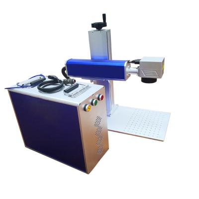 China Xanyi 50W Stainless Steel Laser Engraving Machine Fiber Laser Marking Machine Price Mini Traceability Mobile Logo for sale