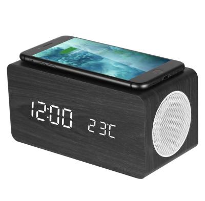 China Hot Selling Multifunctional Alarm Clock Wireless Charger Speaker and Alarm Clock Wooden Material Arrangement for sale