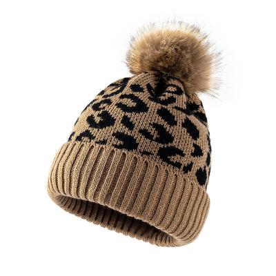 China 2022 COMMON SALE Leopard Print Women Beanie Fur Ball Pom Poms Winter Warm Hat For Women Girl's Hat for sale