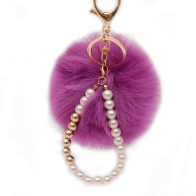 China Faux Fur Ball Pompom Chains 2021 Hot Sale Plush Faux Rabbit Fur Ball Bag Pendant Car Keychain Decorations With Pearl Chain for sale