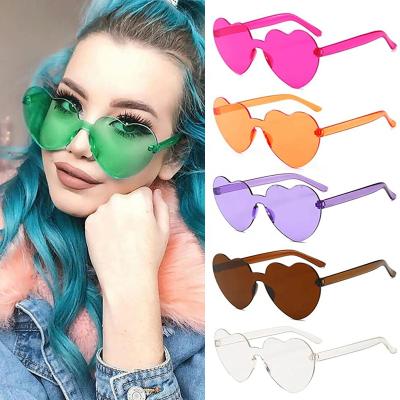 China Around 2022 Women Colors Polycarbonate Heart Shape Tinted Party Sunglasses Girls Vintage UV400 Colors Rimless Polarized Sun Glasses for sale