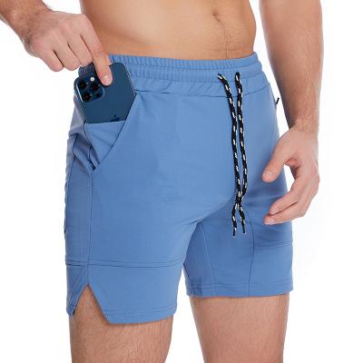 China Custom Plus Size Antibacterial Activewear Workout Blue Zipper 5 Inch Shorts Fitness Men Gym Shorts With Phone Pocket for sale