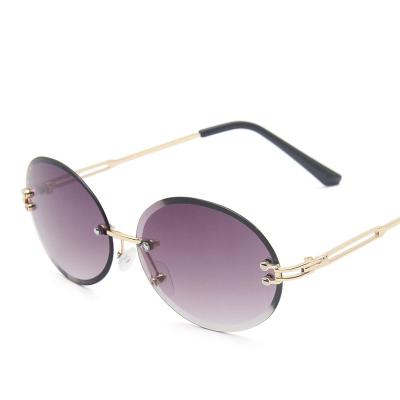 China Hot Selling Street Beat Sunglasses 2020 New Style Fashion Sunglasses Women Shape Frame Rimless Oval Sun Glasses for sale