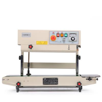 China Food Bag Sealer Food Plastic Bag Strip Sealing Machine Stand Vertical Pouch Sealing Machine for sale