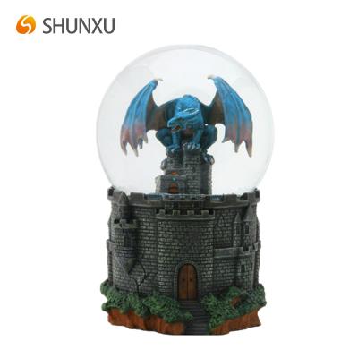 China Europe Souvenir Blue Dragon Water Globe Resin Castle Snow Globe For Gift for sale