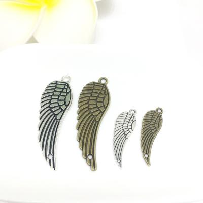 China Designer Silver Copper Zinc Alloy BOHEMIA Double Hole Wings Bulk Pendant Charms For DIY Handmade for sale