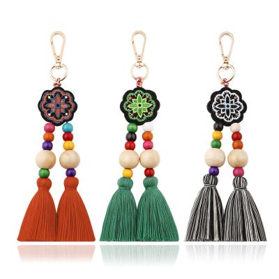 China Promotion Gift Tassel Key Chain Wholesale Bohemian Solid Wood Rice Beads Ornaments Embroidery Ethnic Bag Pendant Jewelry for sale