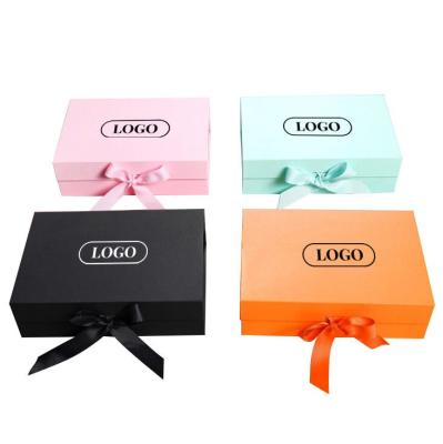 China Recyclable Custom Logo Flat Open Folding Magnet Wig Packaging Box With Ribbon Closure for sale