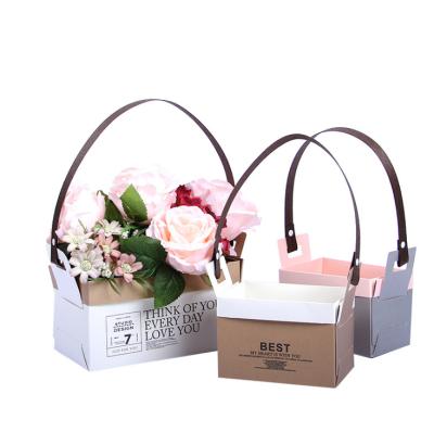 China Wholesale Waterproof Flower Carrier Basket Trapezium Plantpot Paper Packaging Bag With Handles for sale