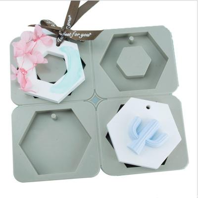 China Disposable Hexagon 4-Cavity Candy Silicone Mold with Hole for Chocolate, Soap Candle Making, Epoxy Resin Casting, Jewelry Crafting Projects for sale