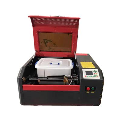 China Ruida 50w 4040 Controller Water Cooled CO2 Laser Engraver for sale