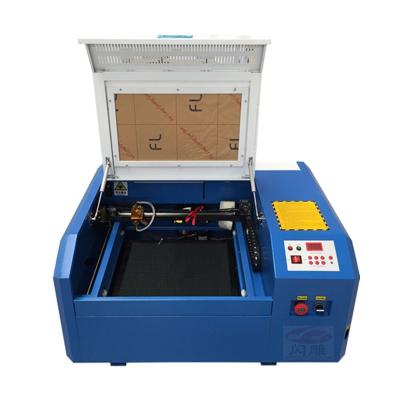 China Laser Engraving 4040 Ruida Control Panel CO2 Laser Engraving Cutting Machine for sale