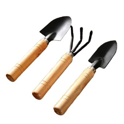 China Easy Carry 3 Pieces Place Mini Garden Tool Spatula Rake Seedling Machine For Outdoor Potted Flowers Iron Wooden Black for sale